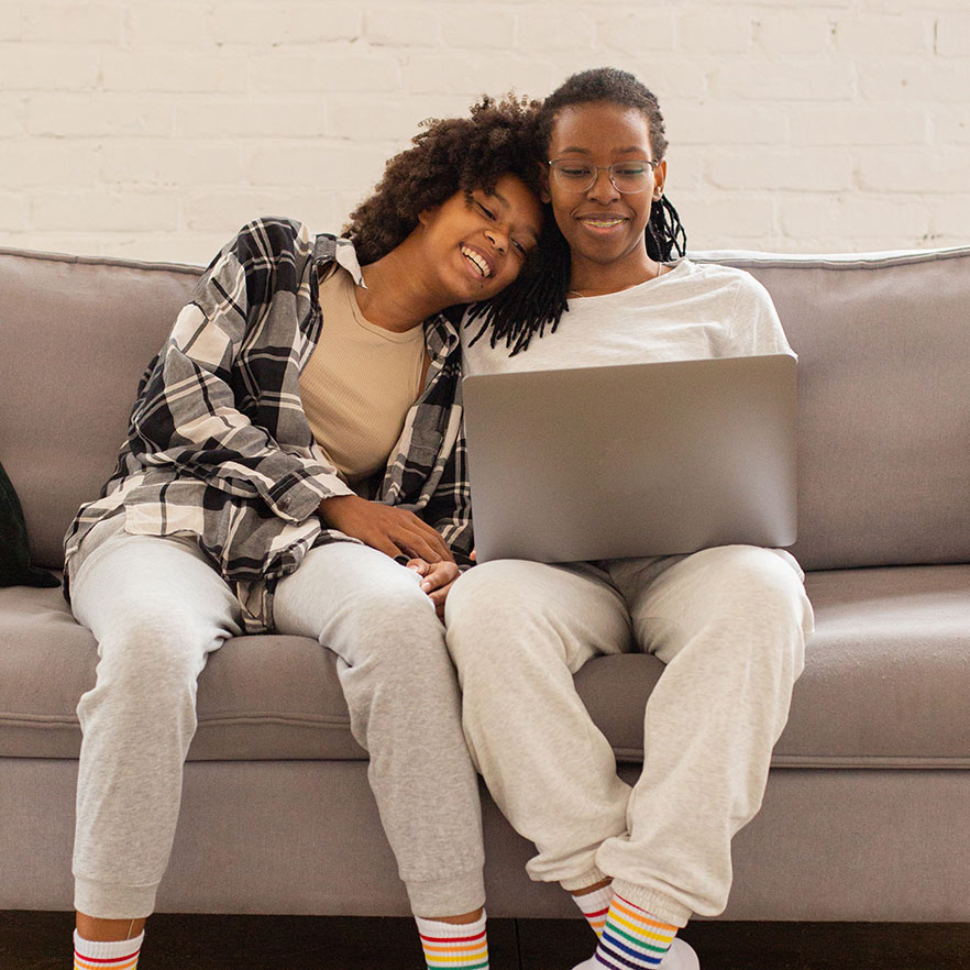 Photo of people with a laptop