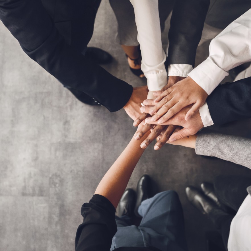 Photo of a team huddle.