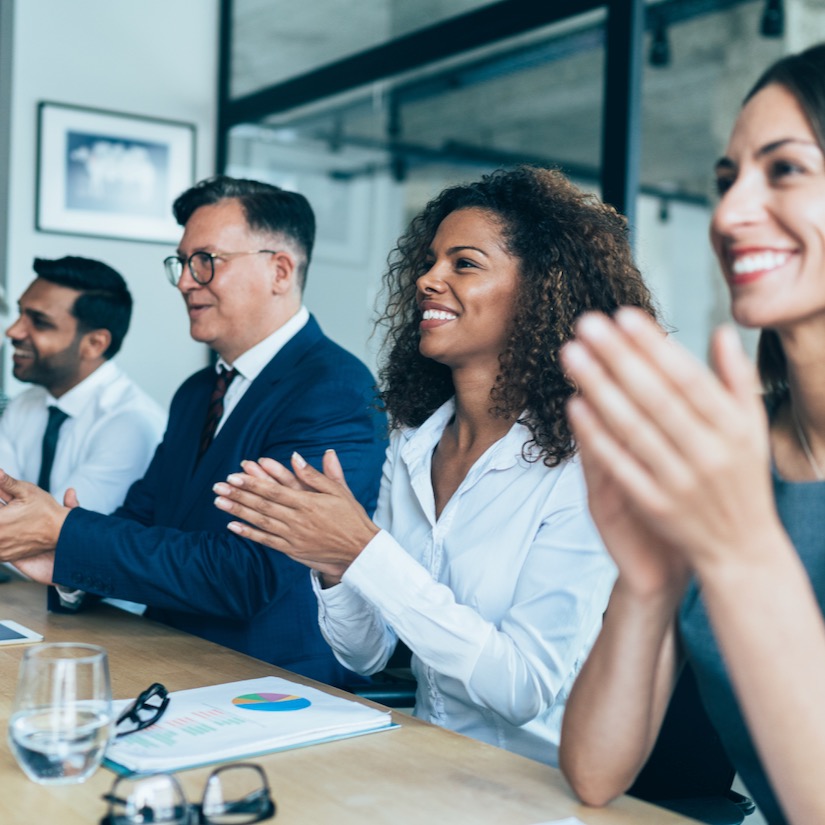 Photo of people in a conference room