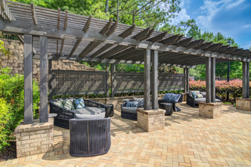 Outdoor Lounge Overlooking The Pool At Waterstone at Big Creek Apartments