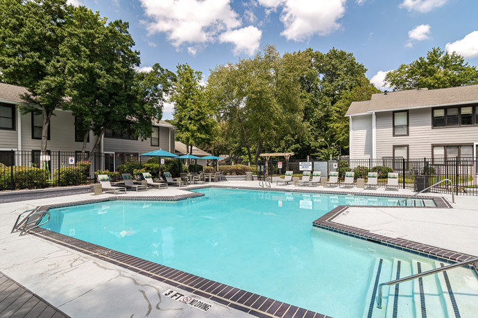 The inviting pool area offers residents a refreshing escape for relaxation and recreation amid beautifully landscaped surroundings.