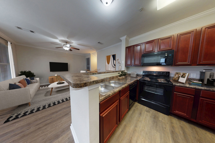 A modern kitchen interior at Sixteen50 at Lake Ray Hubbard, highlighting the functional layout.