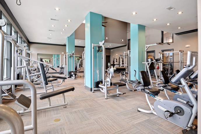 The fitness center facility at Sixteen50 at Lake Ray Hubbard, equipped with exercise machines.