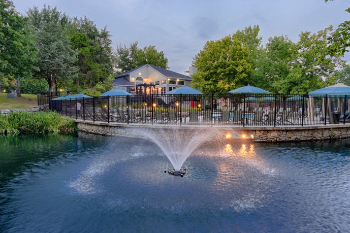 The Landings of Brentwood in Brentwood, TN has a serene pond with a fountain located outside the pool area, providing a peaceful atmosphere.
