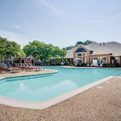 A magnificent resort-style pool situated in front of the clubhouse at Thornhill apartments in Raleigh, North Carolina, offering residents a luxurious outdoor oasis for relaxation and recreation.