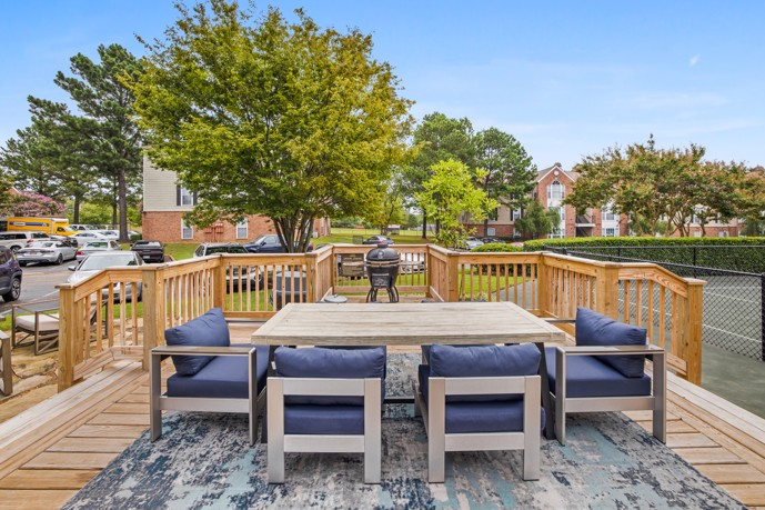 The outdoor lounge area provides residents with a serene and inviting space to relax, socialize, and enjoy the beautiful surroundings of the community.