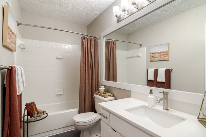 This beautiful bathroom space features sleek fixtures, elegant finishes, and ample natural light, creating a serene retreat for residents to unwind and refresh.