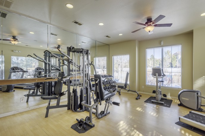 A clean and well equipped fitness and wellness center at Oasis apartments.
