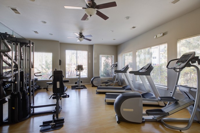 A clean and well equipped fitness and wellness center at Oasis apartments.