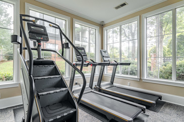 Fitness center cardio equipment including Stairmaster and treadmills and