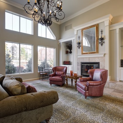A cozy clubhouse with a fireplace and comfortable couches, perfect for relaxation and warmth.