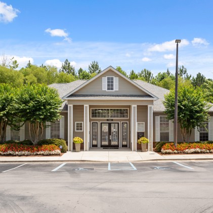 Exterior parking lot view of Bridge Pointe apartments leasing office in Huntsville, AL