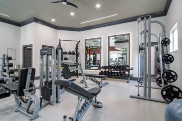 Keep fit in the fitness center loaded with gym equipment to suit anyone's choices at Waterstone at Big Creek. 