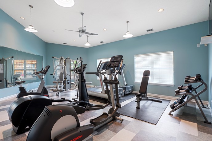 Runaway Bay's fitness center which is equipped with modern exercise machines, free weights, and ample space for workouts.
