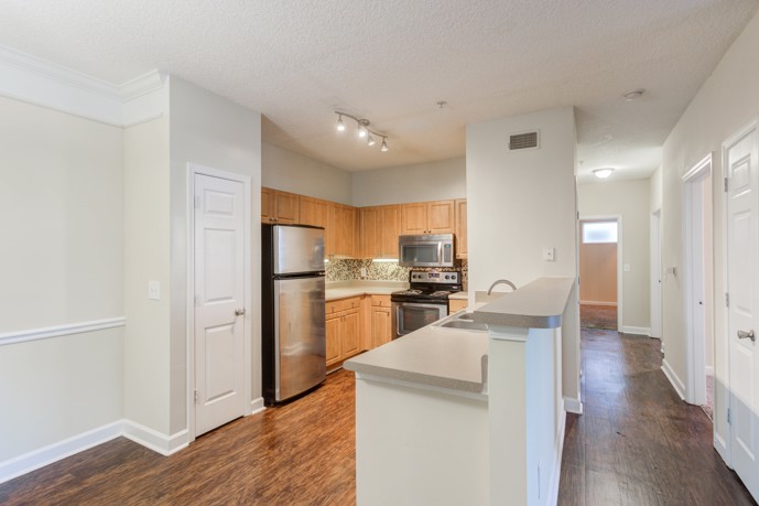 A stylish and functional kitchen at Reserve at Creekside, featuring modern appliances and ample storage space