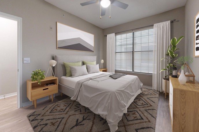 The Delano at North Richland Hills bedroom with hardwood-style flooring, windows, and queen sized bed.