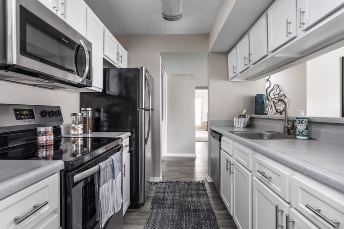 A modern kitchen featuring contemporary appliances and stylish finishes, offering residents a functional and inviting space for cooking and dining.