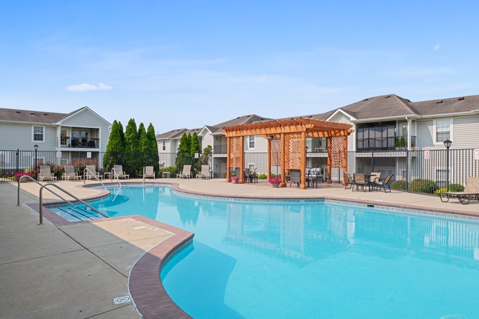 The inviting pool area at Runaway Bay community in Speedway, IN providing residents with a serene and refreshing space to relax and enjoy the outdoors.