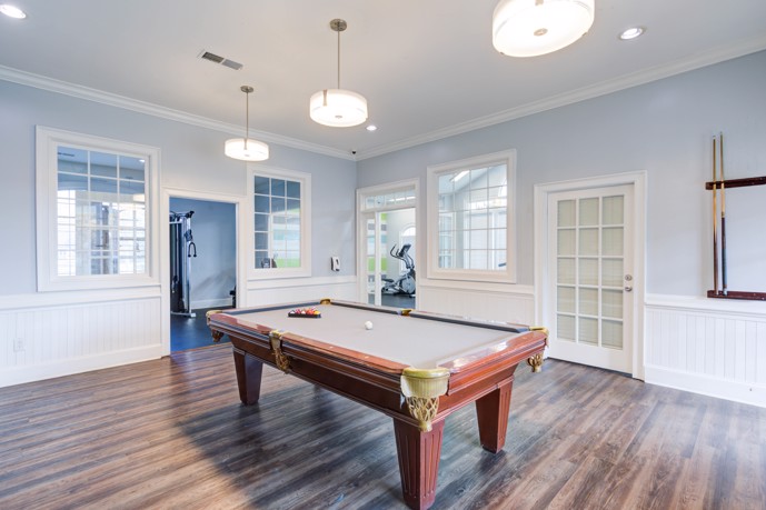 Another perspective of the clubhouse at Reserve at Creekside, highlighting its pool table area.