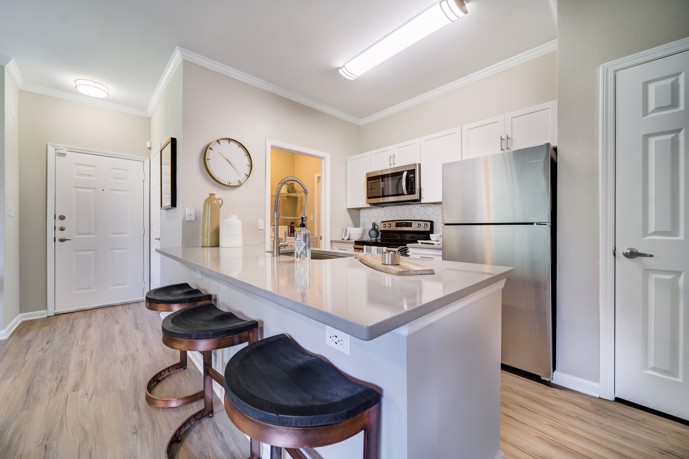 The stylish breakfast bar in an apartment kitchen at Thornhill, featuring a sleek grey quartz countertop that adds a touch of modern elegance to the space.