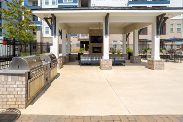 Pool side outdoor grilling station and fireplace
