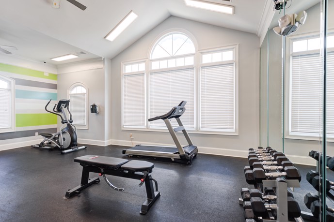 The fitness center at Reserve at Creekside, equipped with modern exercise equipment 