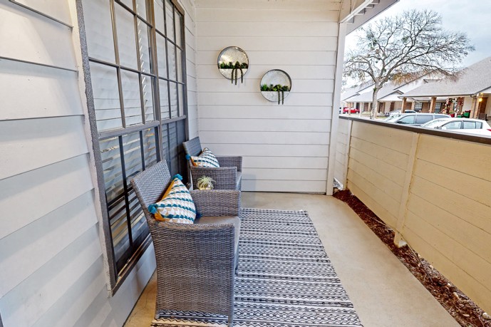 Private apartment patio, providing convenient access to the resident parking area.