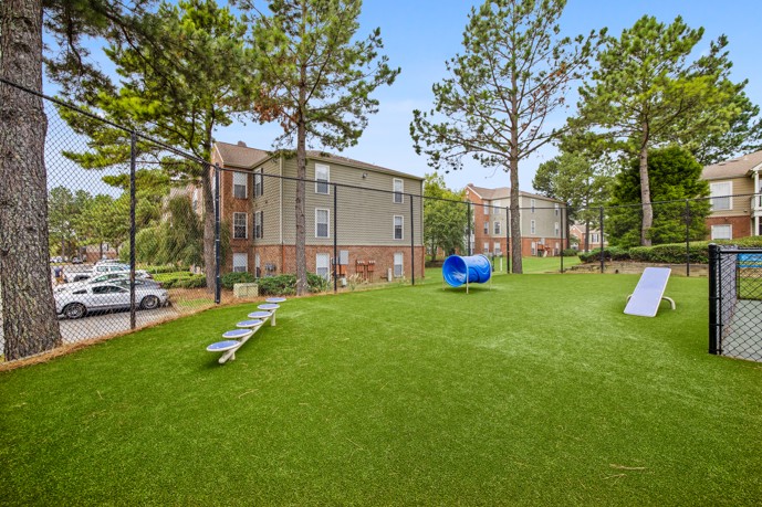 Another view of the dog park, providing residents' pets with ample space and amenities for exercise and socialization in a safe and controlled environment.
