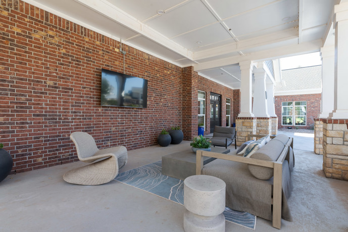 Poolside outdoor lounge with TV perfect for social gatherings