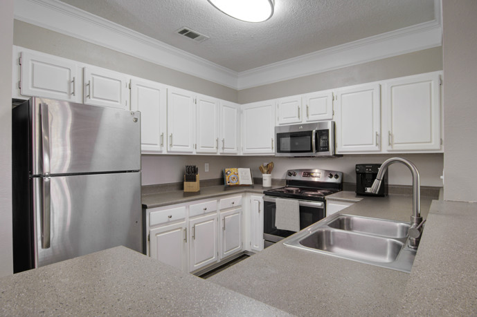 The kitchen interior at Preston Hill, featuring modern appliances and stylish design elements.