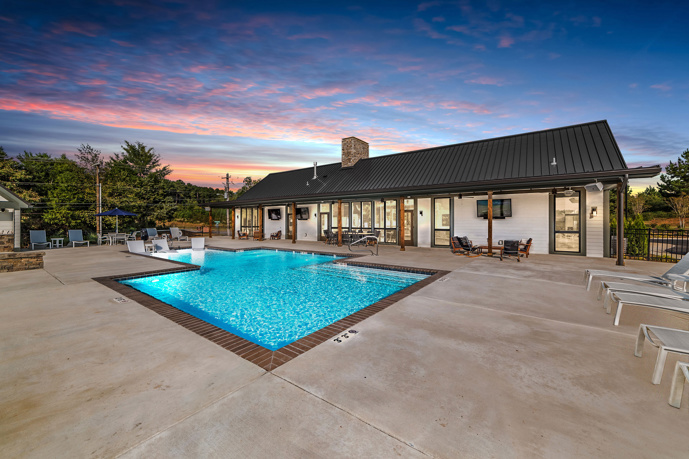 The beautiful pool located next to the clubhouse at Virtuoso apartments in Huntsville, AL, providing residents with a refreshing and luxurious space to relax and unwind.