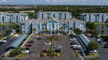 The parking area in front of the apartments at The Enclave at Tranquility Lake at Riverview, FL.