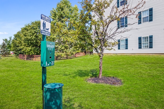 The Commons at Canal Winchester in Columbus, OH, provides a clean and hygienic environment for your furry friend, with a dog waste station surrounded by lush green grass