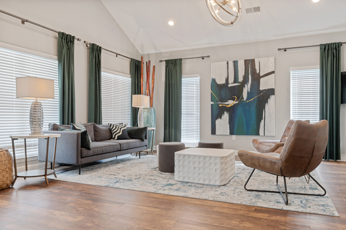 Large outdoor swimming pool with the pool house in the background at Cherry Grove Commons apartments in Sunset Beach, SC