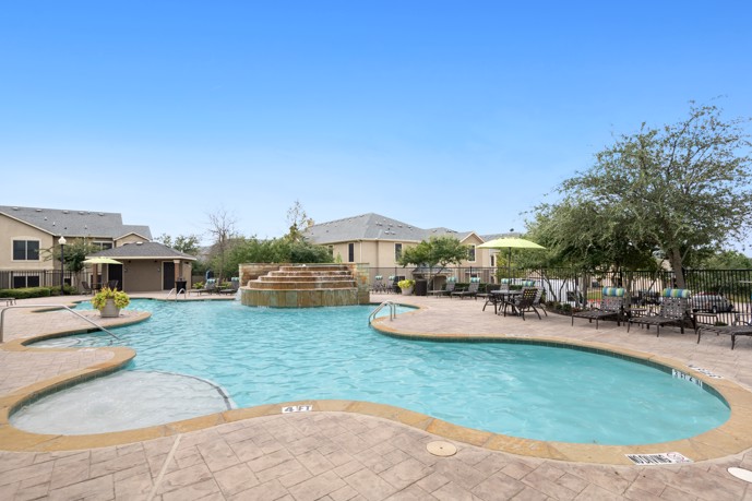 The pool area at Sixteen50 at Lake Ray Hubbard, offering a refreshing area for residents to relax poolside.