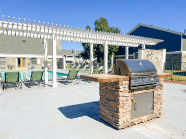 Windrush offers a serene outdoor space with picnic tables, benches, and lush green surroundings.
