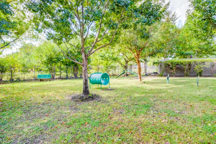 Waterford Place at Riata Ranch has a spacious fenced dog park surrounded by beautiful trees and equipped with everything a pup could need for outdoor fun.
