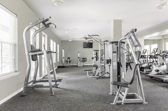 The fitness center at Talison Row, equipped with modern facilities and equipment to support residents' health.