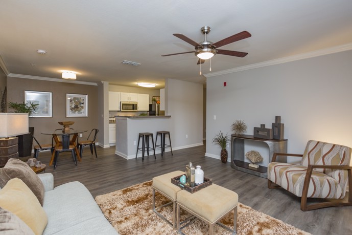 This spacious area features stylish furnishings, warm lighting, and a cozy ambiance
