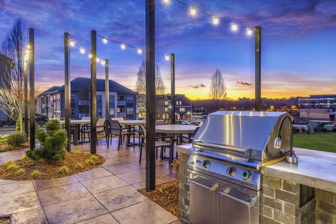 Vesta City Park in Charlotte, NC offers an outdoor grill station complete with tables and chairs, perfect for a fun and memorable cookout with family and friends.