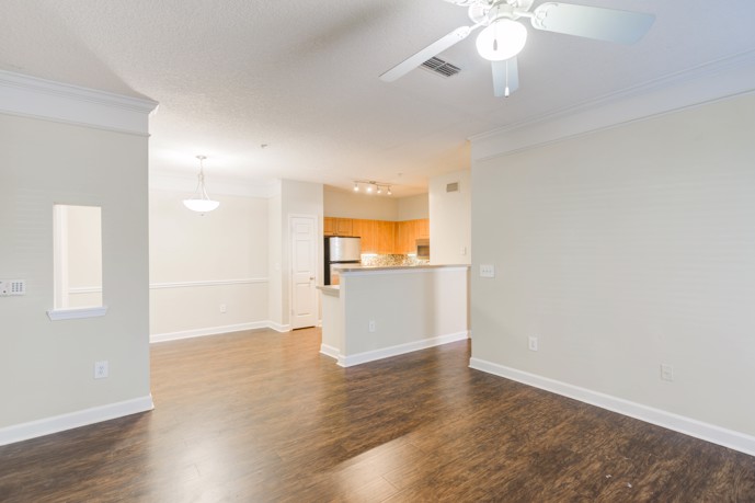 An open floor plan layout at Reserve at Creekside, offering a spacious and interconnected living area for residents.
