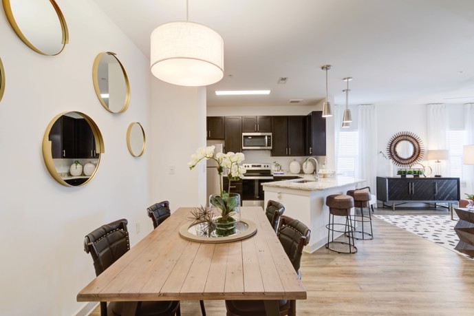 Navigate effortlessly through the open layout dining room, seamlessly connecting the kitchen and living room spaces.