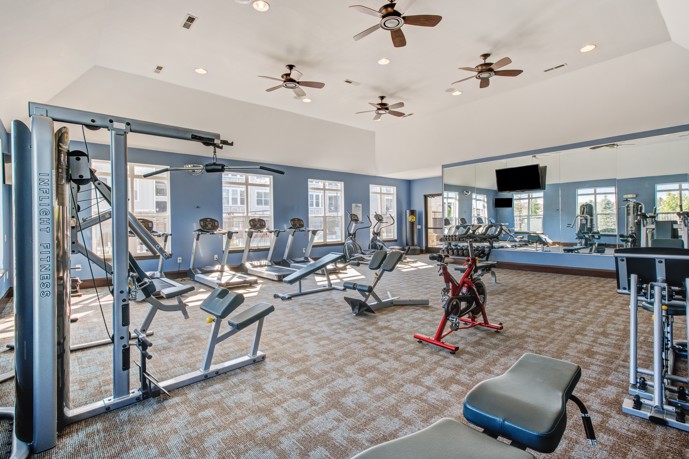 State-of-the-art gym equipment and spacious workout area at Reveal on Cumberland. 
