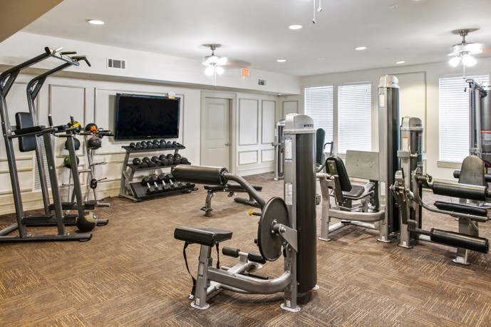 The state-of-the-art fitness center at Tapestry Park in Birmingham, AL, equipped with modern exercise machines and facilities to support residents' active lifestyles.