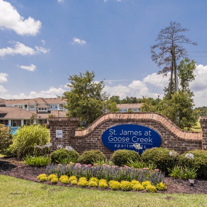 A brick sign at the entrance to St James at Goose Creek apartments.