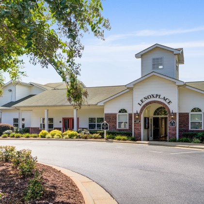 Leasing office of Lenoxplace at Garner Station, nestled amidst meticulously landscaped grounds and conveniently close to parking facilities.