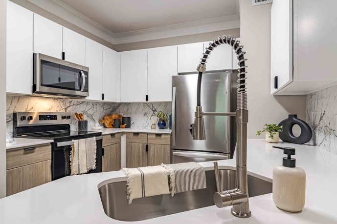 Newly Renovated Kitchen Featuring Quartz Countertops, Stainless Steel Appliances and new Cabinets