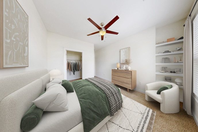 A bedroom, boasting a large window, plush carpet flooring, and a convenient ceiling fan.