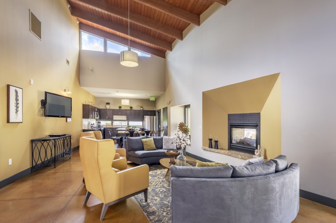 Large, open floor plan resident clubhouse with high ceilings at Bella Terra apartments in Aurora, CO